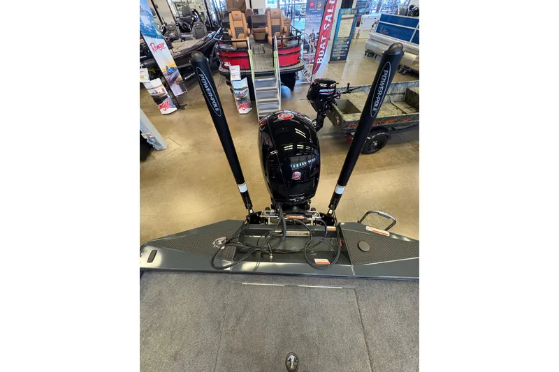 Slide: The Image of 2026 Ranger RT198P boat with Power-Pole anchors displayed in showroom. - 20