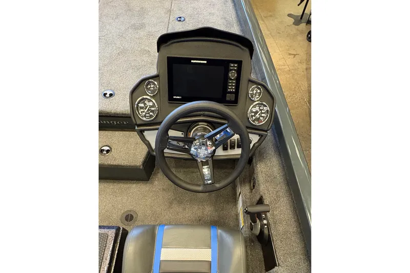Slide: The Image of 2026 Ranger RT198P boat dashboard with steering wheel and electronic display. - 14