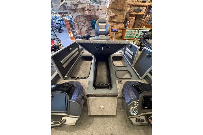 Slide: The Image of 2026 Ranger RT198P boat interior with open storage compartments and seating. - 11
