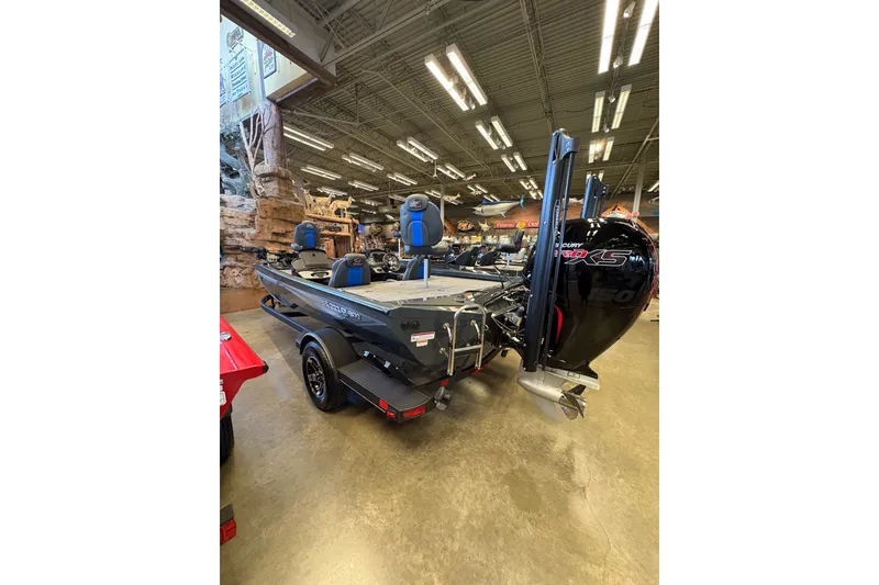 Slide: The Image of 2026 Ranger RT198P boat displayed indoors with powerful Mercury engine. - 5