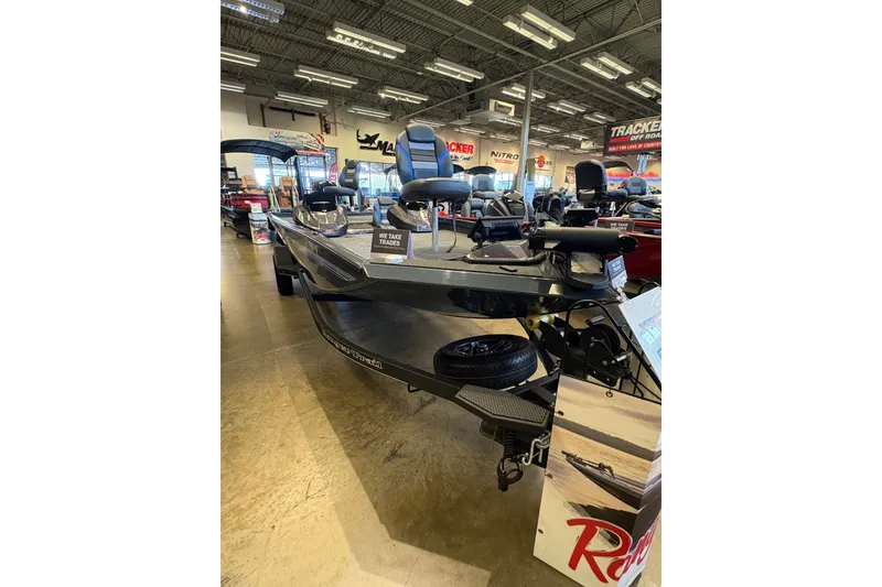 Slide: The Image of 2026 Ranger RT198P fishing boat displayed in showroom with trade-in options. - 1