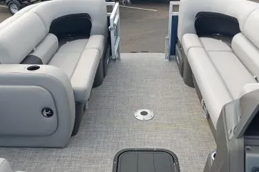 Slide: The Image of 2026 Sun Tracker SportFish 22 XP3 pontoon boat interior with gray seating and flooring. - 6