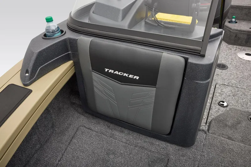 Slide: The Image of 2026 Tracker Targa V-18 Combo boat interior with cup holders and storage compartment. - 22