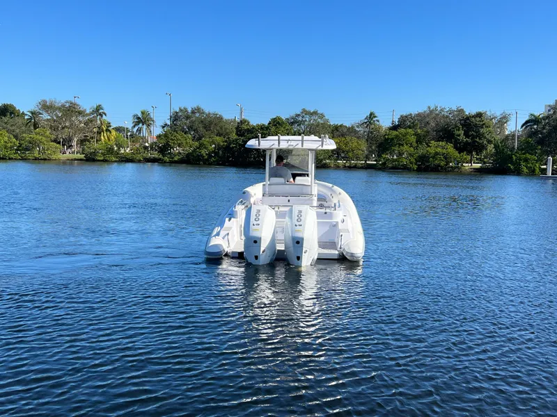 Slide: The Image of 2024 Airship 340 boat with twin engines on a calm lake. - 3