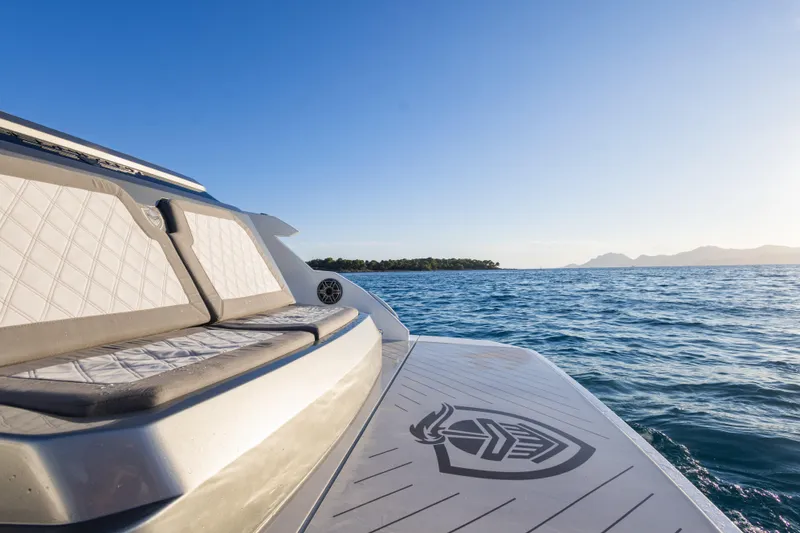 Slide: The Image of 2025 Canados 571 yacht on open sea with clear sky and distant islands. - 6