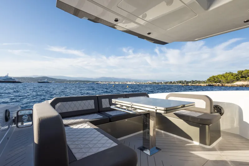 Slide: The Image of Luxury Canados 571 yacht deck with seating area, ocean view, and modern design, 2025 model. - 8