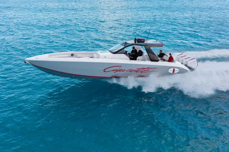 Slide: The Image of 2025 Cigarette 41 Nighthawk speedboat cruising on clear blue water. - 1