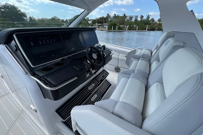 Slide: The Image of Interior of 2025 Cigarette 41 Nighthawk boat with modern dashboard and luxurious seating. - 22