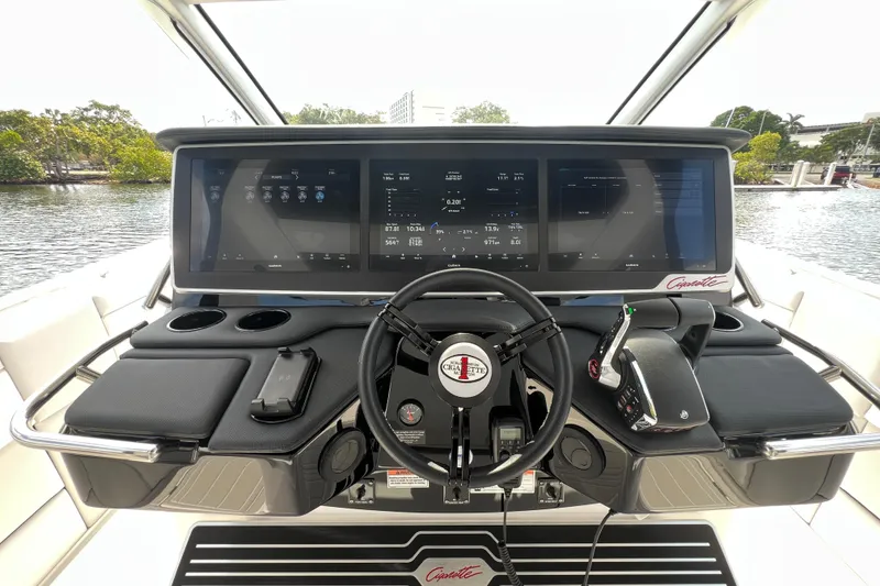 Slide: The Image of 2025 Cigarette 41 Nighthawk boat dashboard with advanced navigation screens and controls. - 25