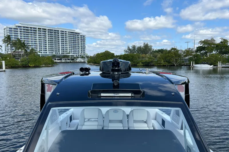 Slide: The Image of 2025 Cigarette 41 Nighthawk boat on water, modern design, luxury interior, scenic background. - 35