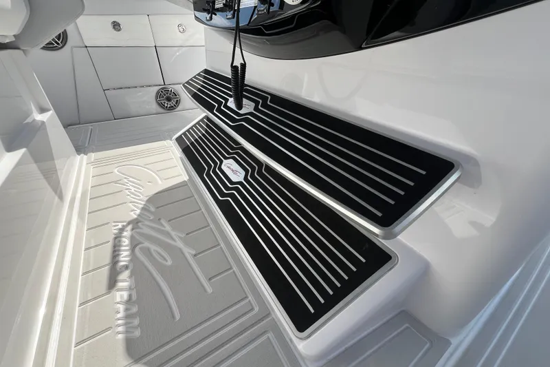 Slide: The Image of 2025 Cigarette 41 Nighthawk boat interior with sleek black and white flooring design. - 43