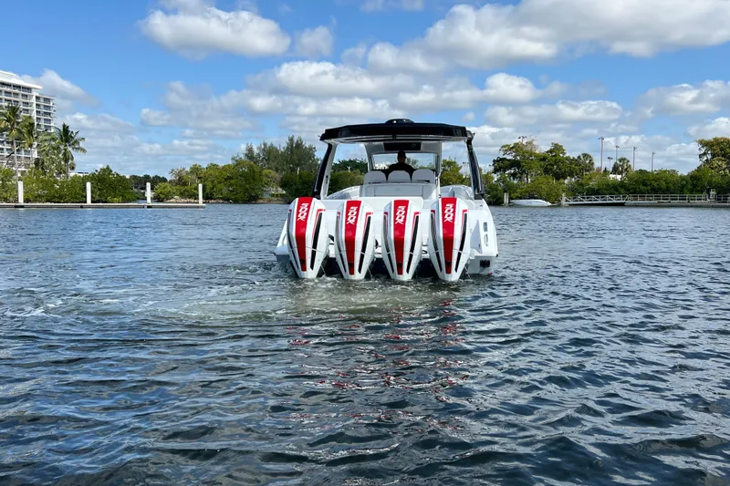 Slide: The Image of 2025 Cigarette 41 Nighthawk boat with quad engines on a sunny day. - 8