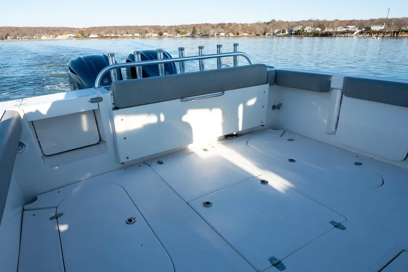 Slide: The Image of 2021 NorthCoast 315 HT boat deck with seating, on calm water. - 17