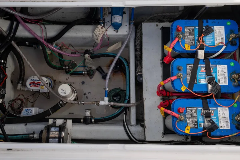 Slide: The Image of Engine compartment of 2021 NorthCoast 315 HT with batteries and wiring. - 22