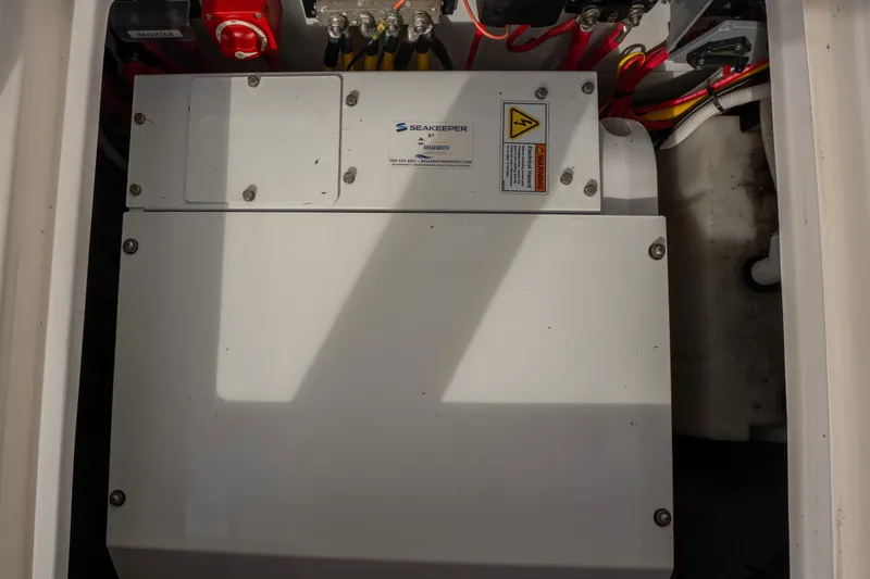 Slide: The Image of Seakeeper system in 2021 NorthCoast 315 HT boat, featuring electrical components and wiring. - 23