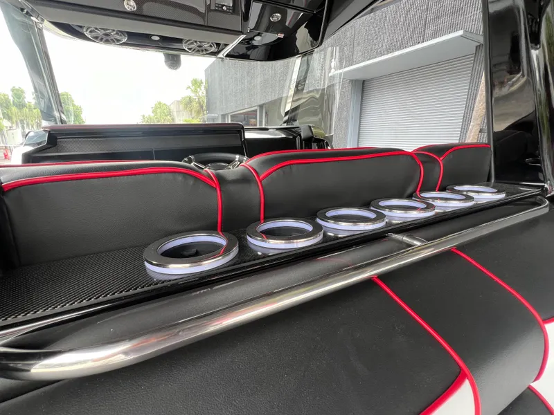 Slide: The Image of 2025 Nor-Tech 400 Supersport interior with sleek black and red seating design. - 13