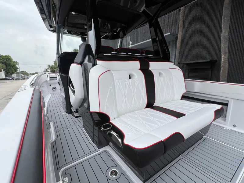Slide: The Image of 2025 Nor-Tech 400 Supersport boat with luxurious white and black seating. - 14
