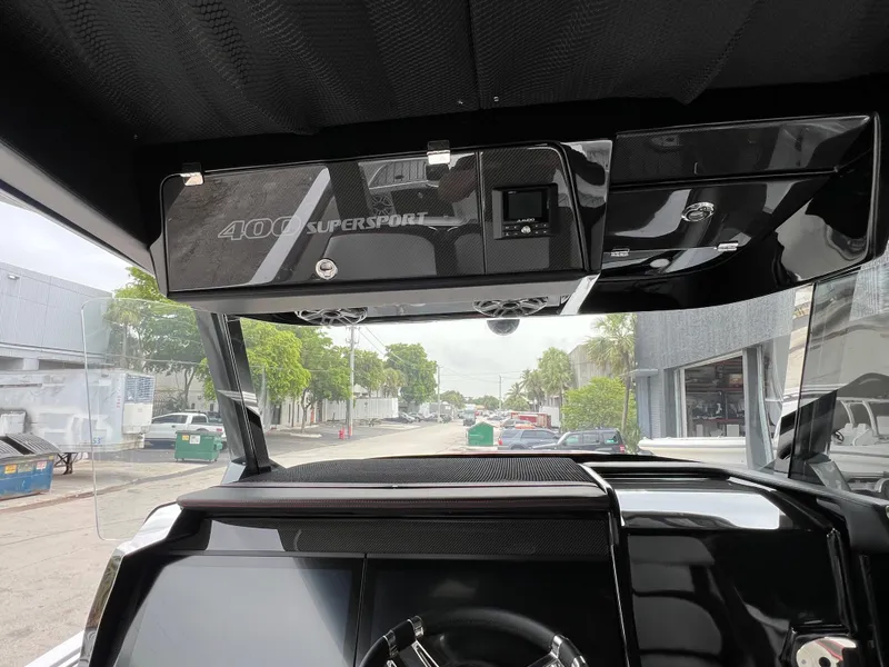 Slide: The Image of Interior view of 2025 Nor-Tech 400 Supersport boat dashboard and controls. - 17