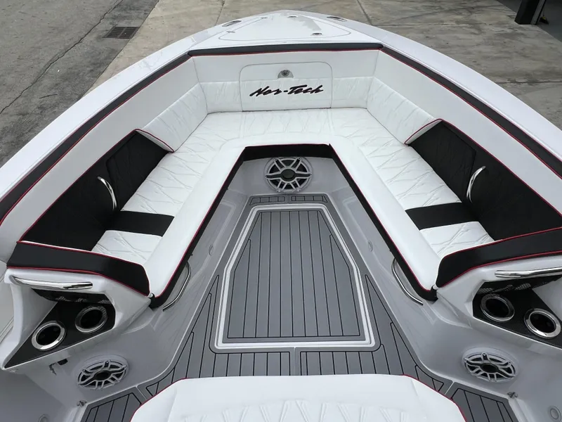 Slide: The Image of 2025 Nor-Tech 400 Supersport boat interior with white seating and modern design. - 20