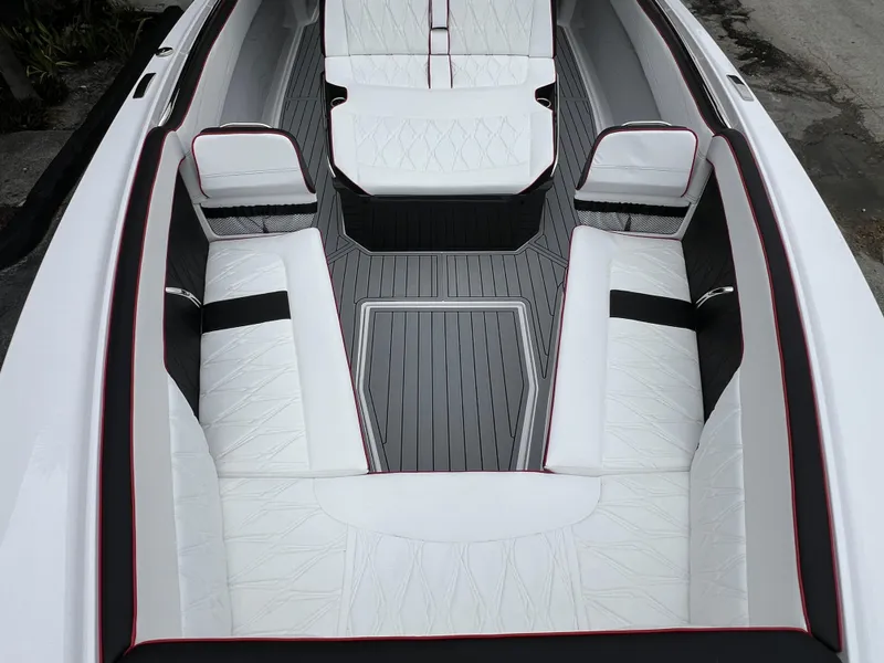 Slide: The Image of Luxurious interior of 2025 Nor-Tech 400 Supersport boat with white seating and sleek design. - 21