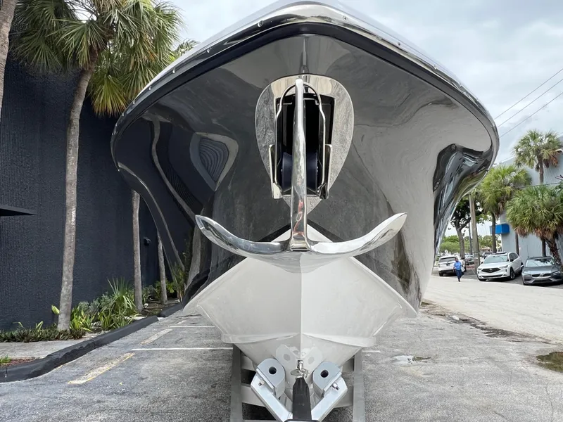 Slide: The Image of Front view of 2025 Nor-Tech 400 Supersport boat, sleek design, parked outdoors. - 3