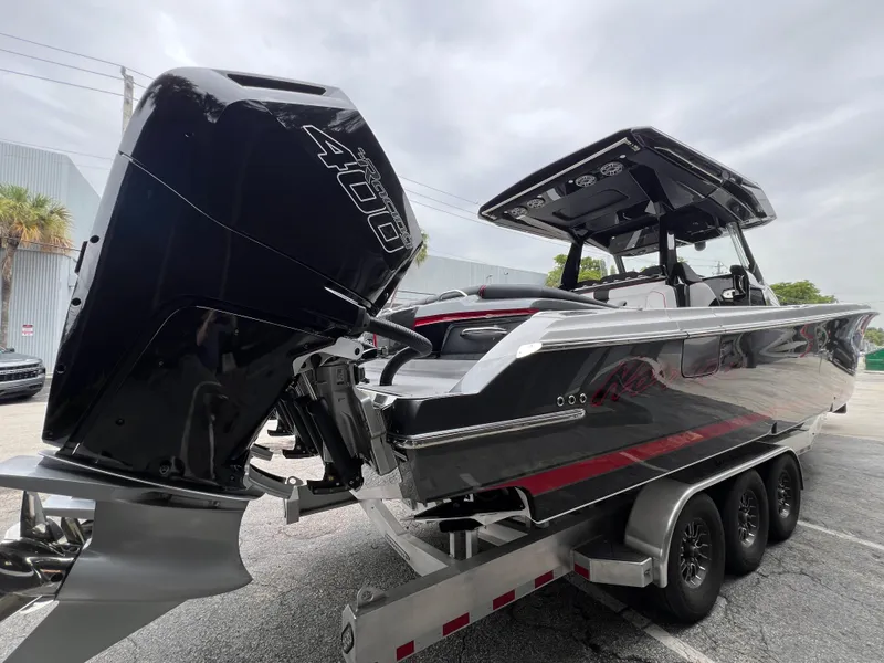 Slide: The Image of 2025 Nor-Tech 400 Supersport boat on trailer, featuring powerful outboard engine. - 7