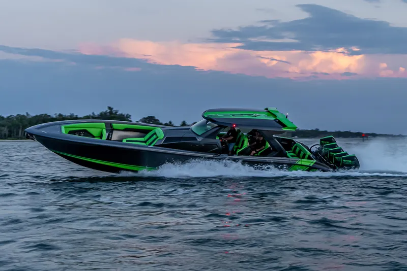 Slide: The Image of 2024 Adrenaline Reaper speedboat cruising on water at sunset, featuring sleek design and vibrant colors. - 5