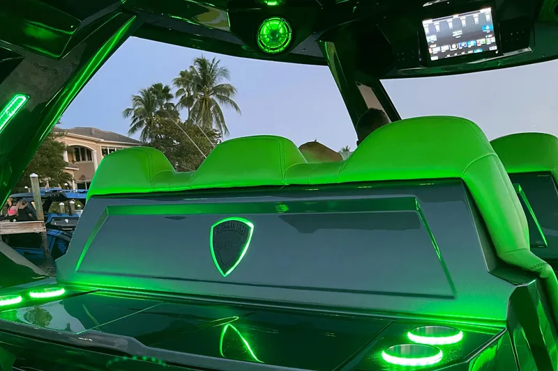 Slide: The Image of 2024 Adrenaline Reaper interior with green LED lighting and modern dashboard. - 9