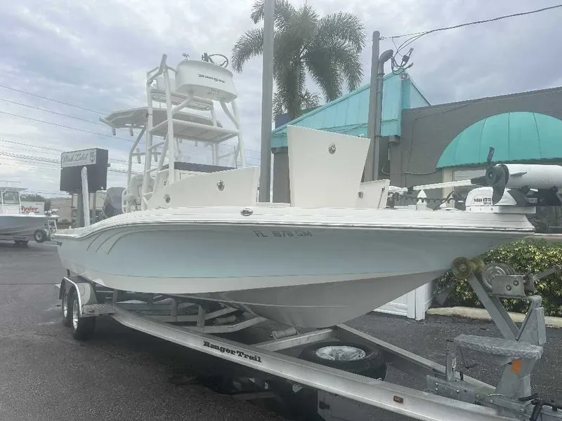 Slide: The Image of 2019 Ranger 2510 Bay Ranger boat on trailer, parked outdoors. - 2