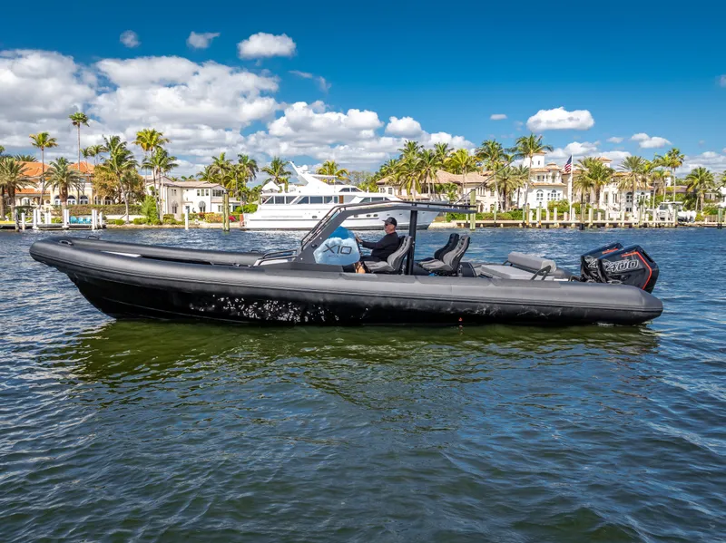 Slide: The Image of 2024 Goldfish X10 Scout boat on a sunny day in a marina. - 16