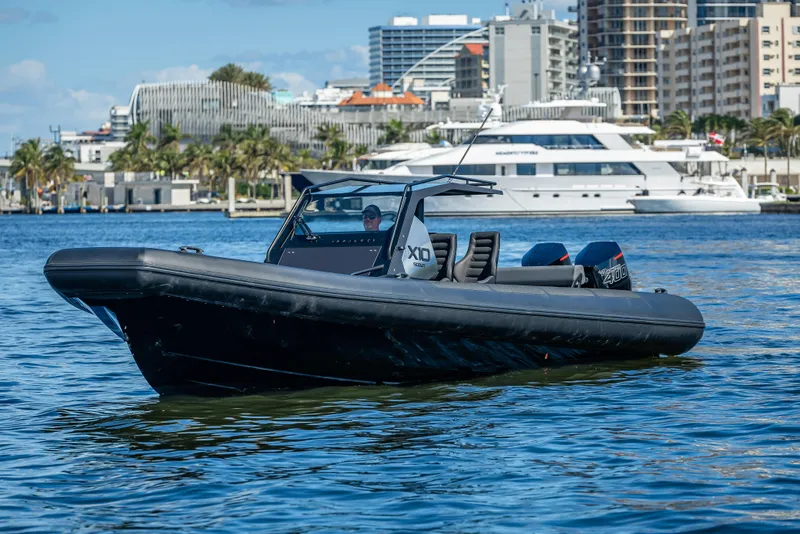 Slide: The Image of 2024 Goldfish X10 Scout boat on water with cityscape background. - 19