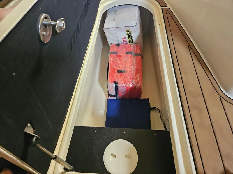 Slide: The Image of Storage compartment in 2021 Statement 350 Open boat with safety gear and equipment. - 19