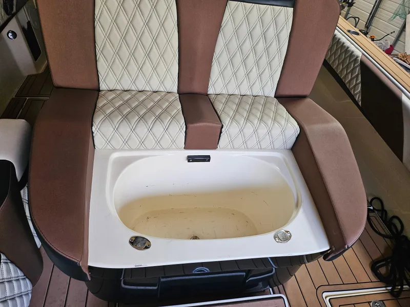 Slide: The Image of 2021 Statement 350 Open boat seat with integrated storage compartment. - 21