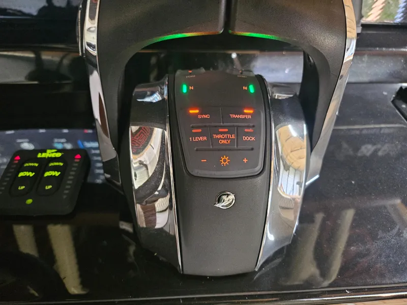 Slide: The Image of Boat throttle control panel on a 2021 Statement 350 Open. - 26