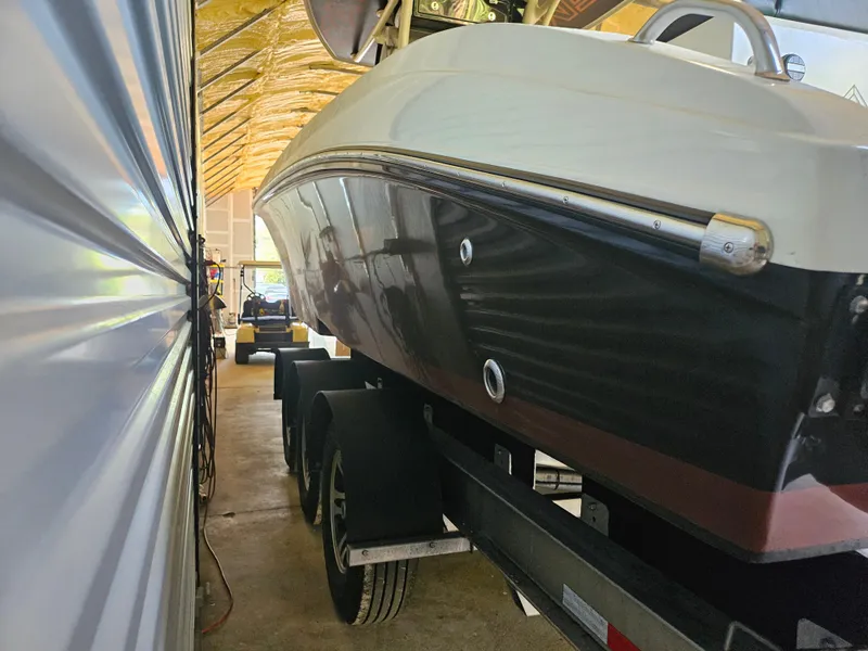 Slide: The Image of 2021 Statement 350 Open boat on trailer in storage facility. - 29