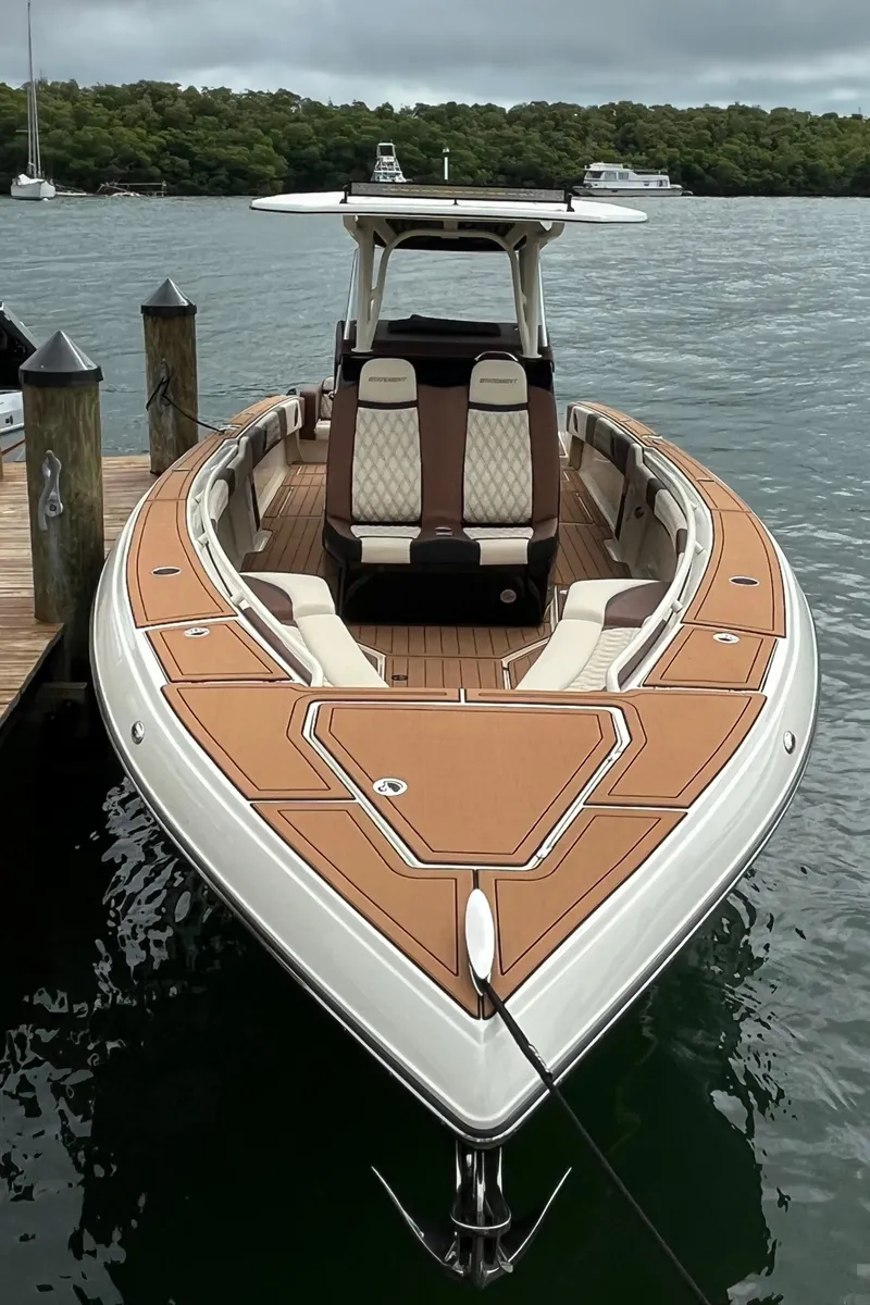 Slide: The Image of 2021 Statement 350 Open boat docked, featuring sleek design and luxurious seating. - 39