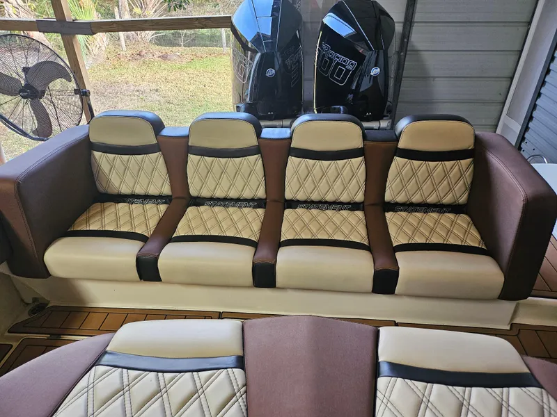 Slide: The Image of Luxurious seating on 2021 Statement 350 Open boat, featuring quilted upholstery and dual engines. - 7