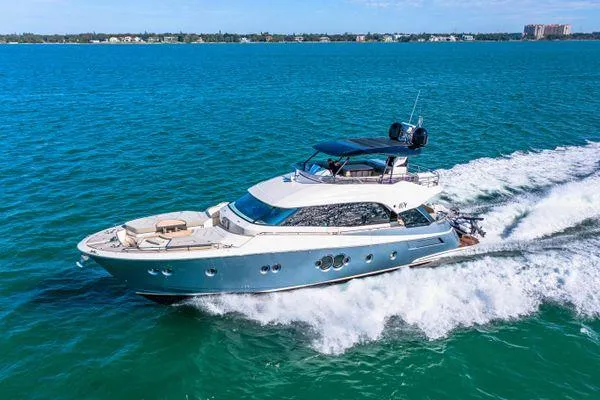 Slide: The Image of Luxurious 2018 Monte Carlo Yachts MCY 70 cruising on clear blue waters. - 0