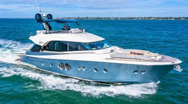 Slide: The Image of Luxurious 2018 Monte Carlo Yachts MCY 70 cruising on open water. - 13