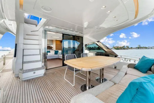 Slide: The Image of Luxurious 2018 Monte Carlo Yachts MCY 70 deck with seating and ocean view. - 16