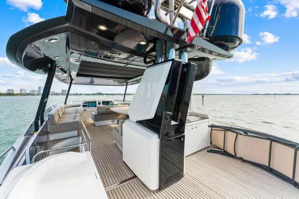 Slide: The Image of Luxurious 2018 Monte Carlo Yachts MCY 70 on open water, featuring spacious deck and modern amenities. - 32