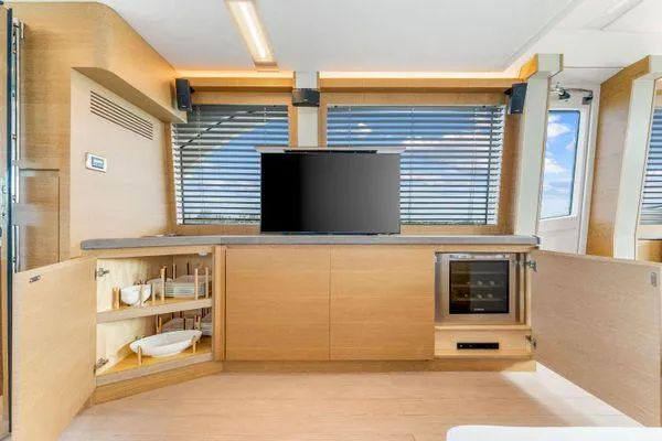 Slide: The Image of Luxurious 2018 Monte Carlo Yachts MCY 70 interior with modern cabinetry and entertainment system. - 43