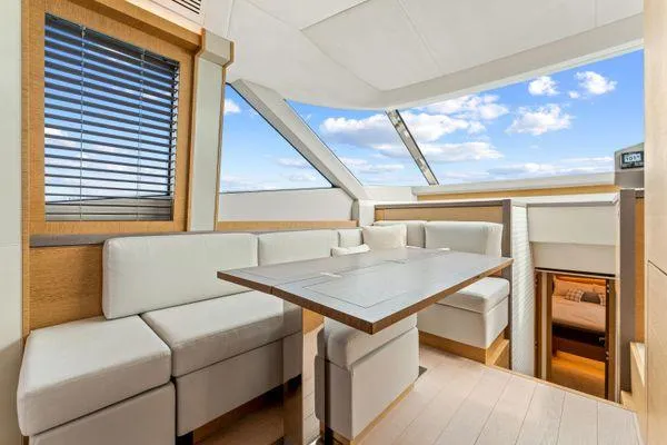 Slide: The Image of Luxurious interior of 2018 Monte Carlo Yachts MCY 70 with elegant seating and panoramic windows. - 44