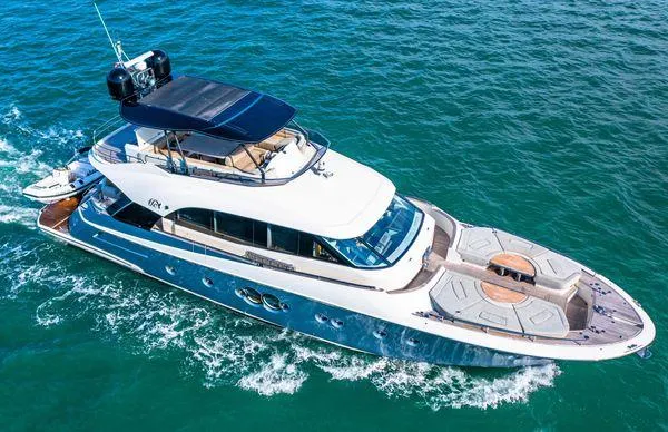 Slide: The Image of 2018 Monte Carlo Yachts MCY 70 cruising on open water. - 7