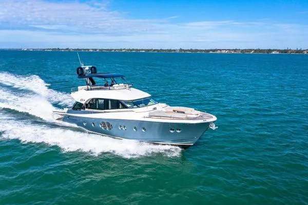 Slide: The Image of 2018 Monte Carlo Yachts MCY 70 cruising on blue ocean waters. - 11