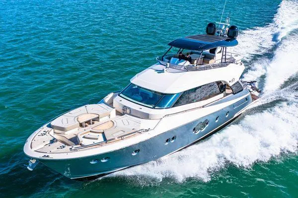Slide: The Image of 2018 Monte Carlo Yachts MCY 70 cruising on open water. - 12