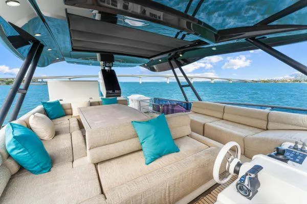 Slide: The Image of Luxurious 2018 Monte Carlo Yachts MCY 70 with spacious deck and elegant seating. - 28