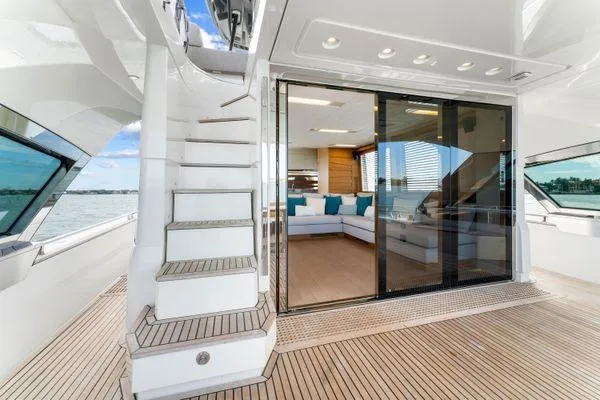 Slide: The Image of Luxurious 2018 Monte Carlo Yachts MCY 70 interior with elegant staircase and spacious seating area. - 37