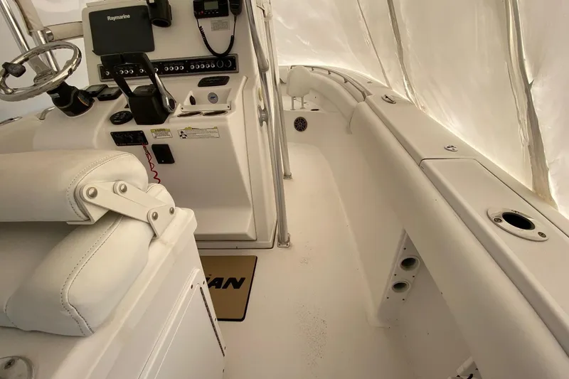 Slide: The Image of 2014 Sportsman Heritage 251 Center Console interior with steering wheel and control panel. - 10