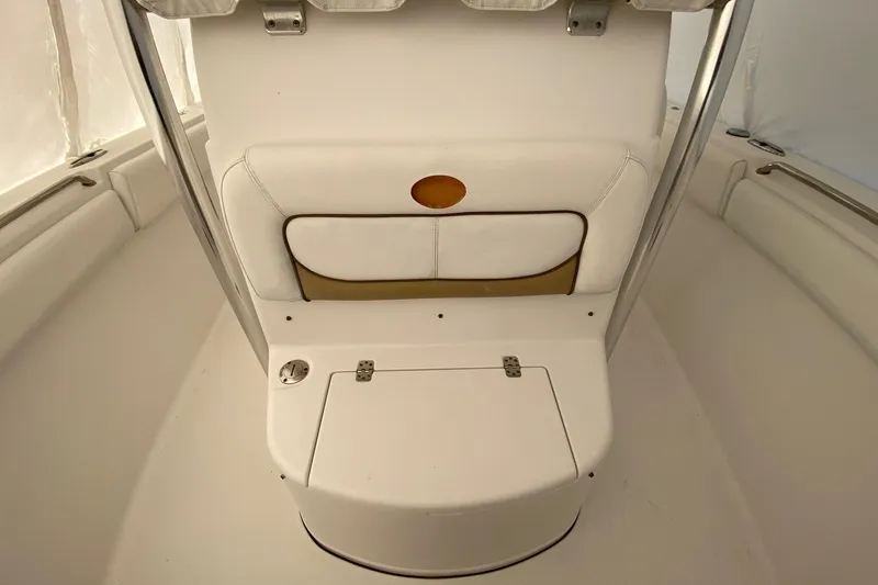 Slide: The Image of 2014 Sportsman Heritage 251 Center Console interior seating area with storage compartment. - 15
